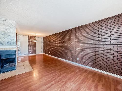 28 3111 142 Avenue, Edmonton, AB - Indoor Photo Showing Other Room With Fireplace