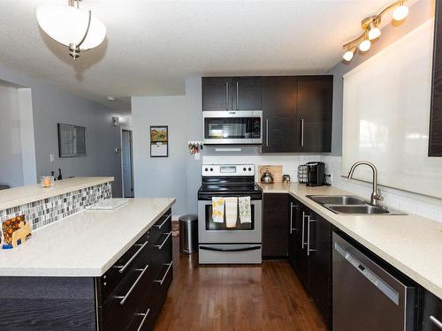 10603 103A Street, Westlock, AB - Indoor Photo Showing Kitchen With Double Sink