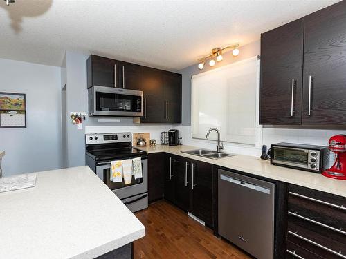 10603 103A Street, Westlock, AB - Indoor Photo Showing Kitchen With Double Sink