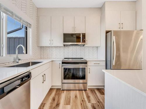 20 2215 24 Street Nw, Edmonton, AB - Indoor Photo Showing Kitchen With Stainless Steel Kitchen With Upgraded Kitchen