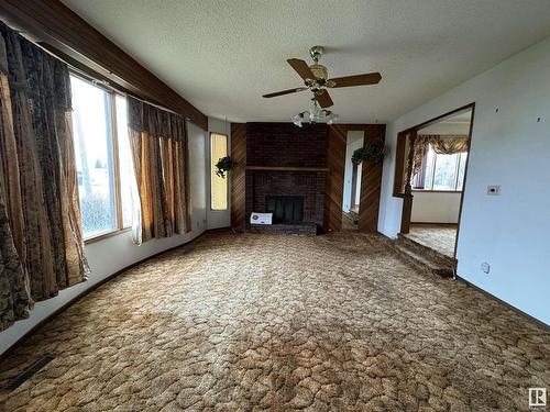 4501 52 Street, Two Hills, AB - Indoor Photo Showing Other Room With Fireplace