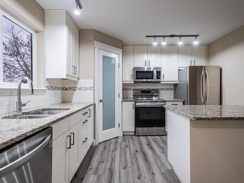 11638 80 Street, Edmonton, AB - Indoor Photo Showing Kitchen With Stainless Steel Kitchen With Double Sink With Upgraded Kitchen