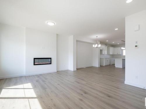 32 Hunter Place, Spruce Grove, AB - Indoor Photo Showing Living Room With Fireplace