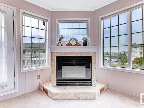 316 17151 94A Avenue, Edmonton, AB - Indoor Photo Showing Living Room With Fireplace