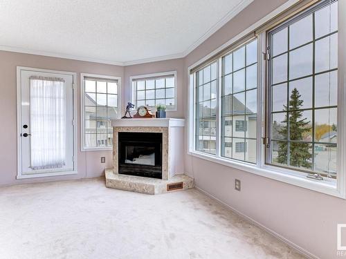 316 17151 94A Avenue, Edmonton, AB - Indoor Photo Showing Living Room With Fireplace