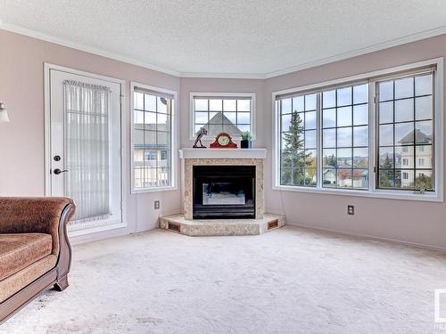 316 17151 94A Avenue, Edmonton, AB - Indoor Photo Showing Living Room With Fireplace