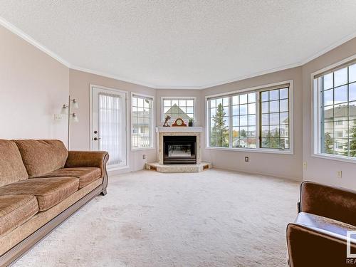 316 17151 94A Avenue, Edmonton, AB - Indoor Photo Showing Living Room With Fireplace