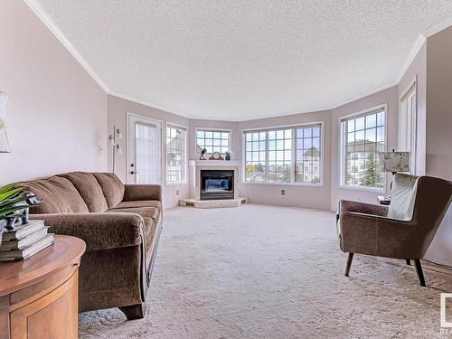 316 17151 94A Avenue, Edmonton, AB - Indoor Photo Showing Living Room With Fireplace