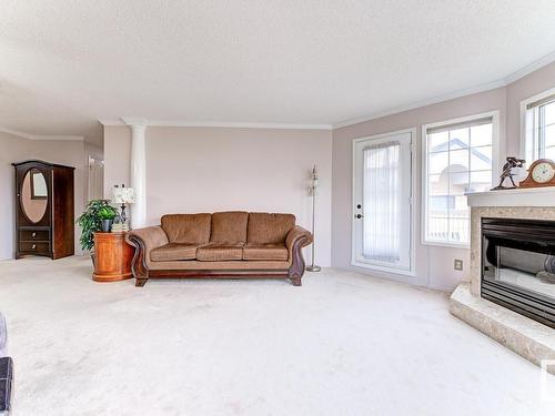 316 17151 94A Avenue, Edmonton, AB - Indoor Photo Showing Living Room With Fireplace