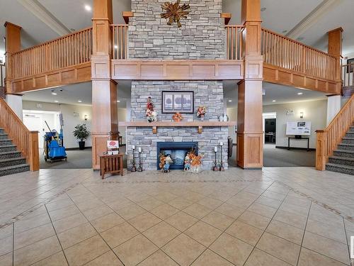 114 511 Queen Street, Spruce Grove, AB - Indoor Photo Showing Other Room With Fireplace