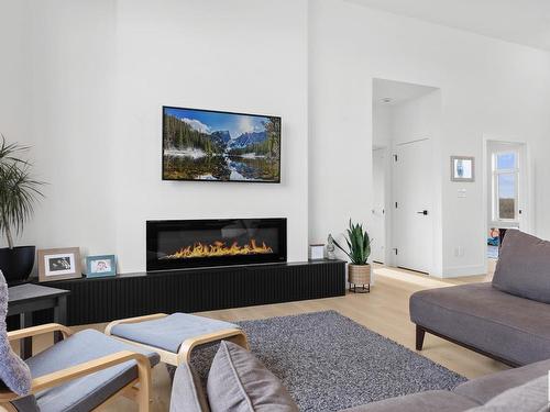 9 1118 Twp Road 534, Rural Parkland County, AB - Indoor Photo Showing Living Room With Fireplace