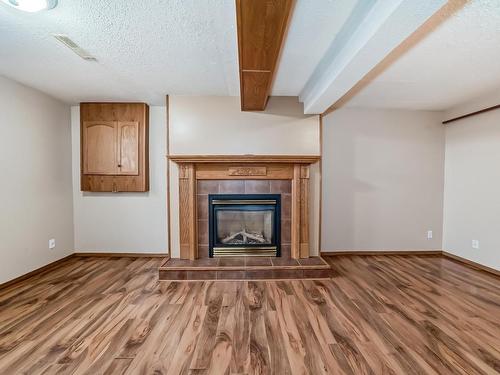 3561 53 Street, Wetaskiwin, AB - Indoor Photo Showing Living Room With Fireplace