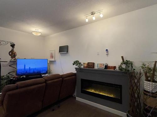 16 450 Mcconachie Way, Edmonton, AB - Indoor Photo Showing Living Room With Fireplace