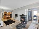 402 9020 Jasper Avenue, Edmonton, AB  - Indoor Photo Showing Living Room With Fireplace 