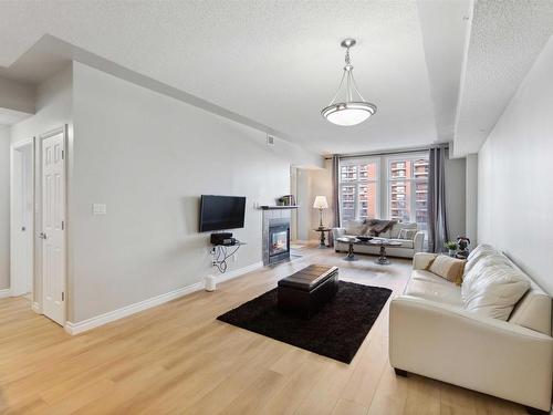 402 9020 Jasper Avenue, Edmonton, AB - Indoor Photo Showing Living Room With Fireplace