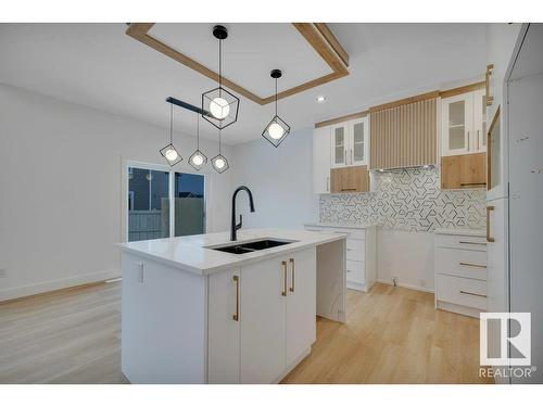 18 Sturtz Place, Leduc, AB - Indoor Photo Showing Kitchen With Double Sink With Upgraded Kitchen