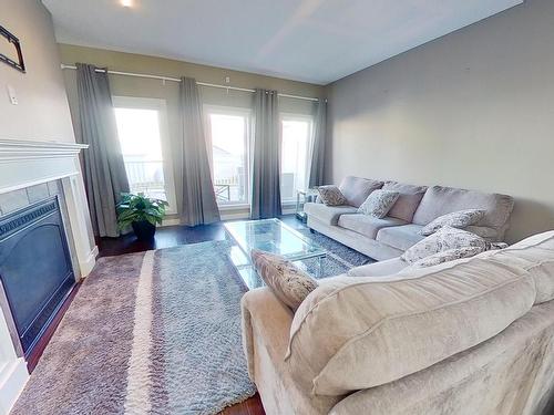 7706 20A Avenue, Edmonton, AB - Indoor Photo Showing Living Room With Fireplace