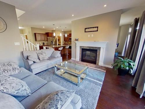 7706 20A Avenue, Edmonton, AB - Indoor Photo Showing Living Room With Fireplace