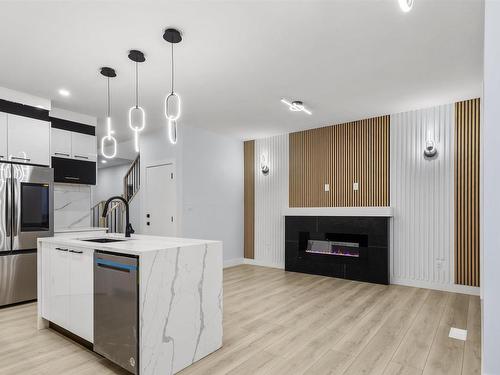 2006 155 Avenue, Edmonton, AB - Indoor Photo Showing Kitchen With Fireplace With Upgraded Kitchen