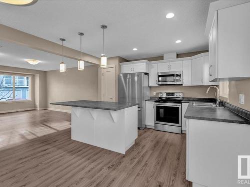 25 2121 Haddow Drive, Edmonton, AB - Indoor Photo Showing Kitchen With Stainless Steel Kitchen With Double Sink With Upgraded Kitchen