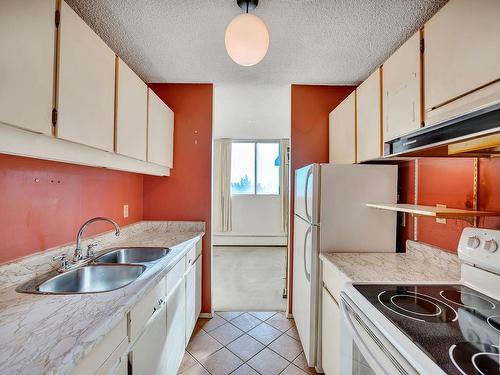 410 13910 Stony Plain Road, Edmonton, AB - Indoor Photo Showing Kitchen With Double Sink