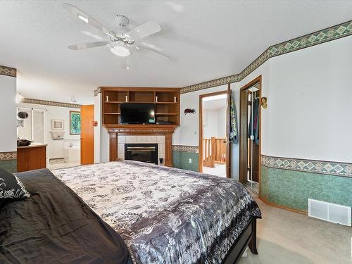 11415 9 Avenue, Edmonton, AB - Indoor Photo Showing Bedroom With Fireplace