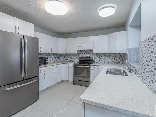 63 Alderwood Boulevard, St. Albert, AB - Indoor Photo Showing Kitchen With Double Sink