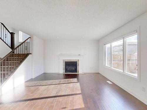 3207 13 Avenue, Edmonton, AB - Indoor Photo Showing Living Room With Fireplace