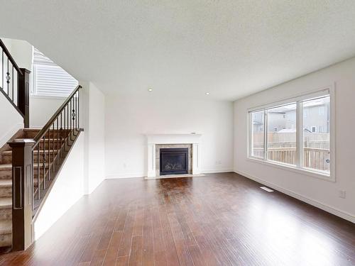 3207 13 Avenue, Edmonton, AB - Indoor Photo Showing Living Room With Fireplace