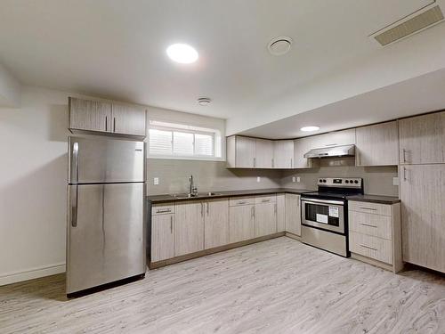 3207 13 Avenue, Edmonton, AB - Indoor Photo Showing Kitchen With Double Sink