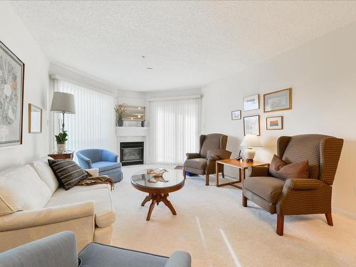 402 182 Haddow Close, Edmonton, AB - Indoor Photo Showing Living Room With Fireplace