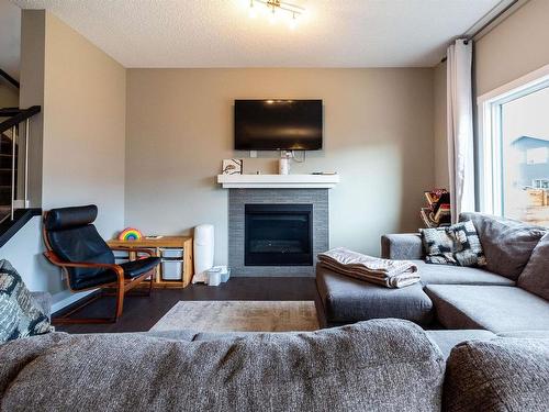 2921 Kostash Drive, Edmonton, AB - Indoor Photo Showing Living Room With Fireplace