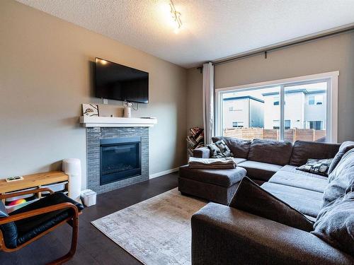 2921 Kostash Drive, Edmonton, AB - Indoor Photo Showing Living Room With Fireplace