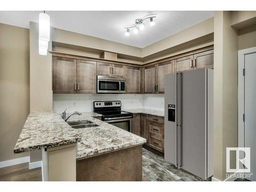 104 2584 Anderson Way, Edmonton, AB - Indoor Photo Showing Kitchen With Stainless Steel Kitchen With Double Sink