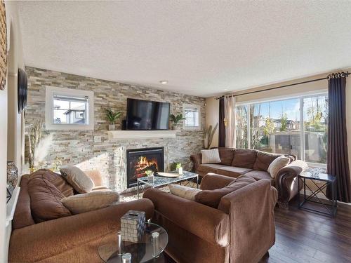 488 Hunters Green Green, Edmonton, AB - Indoor Photo Showing Living Room With Fireplace