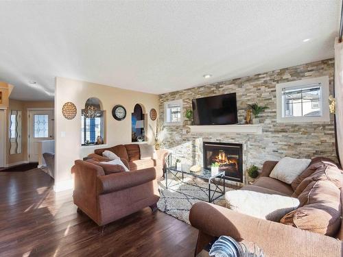 488 Hunters Green Green, Edmonton, AB - Indoor Photo Showing Living Room With Fireplace