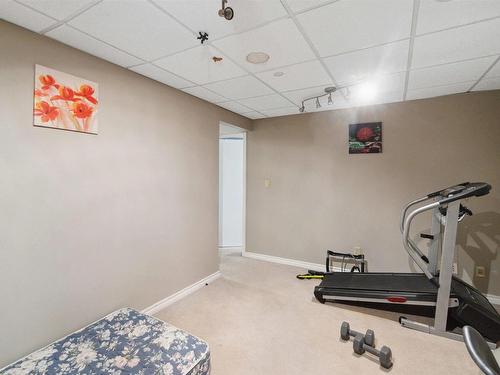 488 Hunters Green Green, Edmonton, AB - Indoor Photo Showing Gym Room