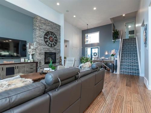 803 52328 Rge Road 233, Rural Strathcona County, AB - Indoor Photo Showing Living Room With Fireplace