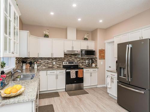 3 1780 Glastonbury Boulevard, Edmonton, AB - Indoor Photo Showing Kitchen With Stainless Steel Kitchen With Double Sink With Upgraded Kitchen