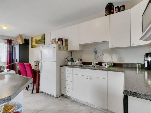 20 1580 Mill Woods Rd E, Edmonton, AB - Indoor Photo Showing Kitchen With Double Sink