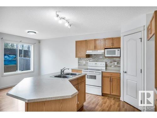 103 Rue Masson, Beaumont, AB - Indoor Photo Showing Kitchen With Double Sink