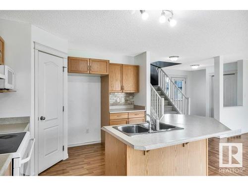 103 Rue Masson, Beaumont, AB - Indoor Photo Showing Kitchen With Double Sink