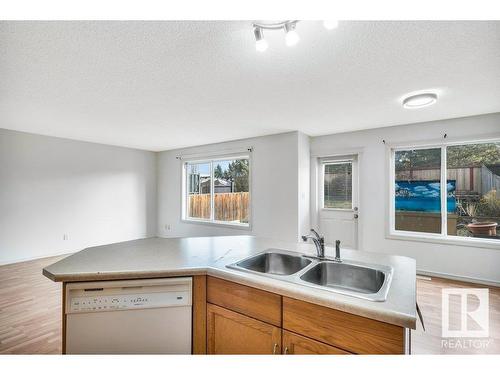 103 Rue Masson, Beaumont, AB - Indoor Photo Showing Kitchen With Double Sink