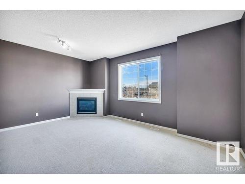 103 Rue Masson, Beaumont, AB - Indoor With Fireplace