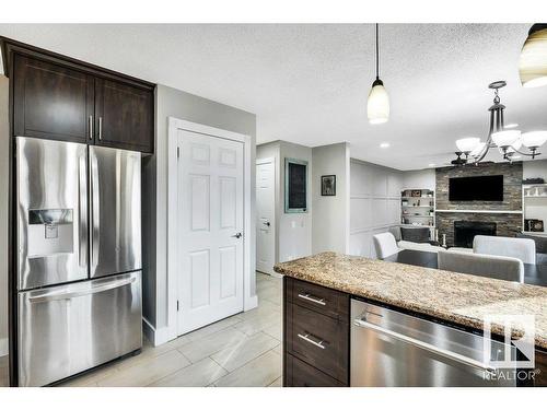 16 Westridge Crescent, Edmonton, AB - Indoor Photo Showing Kitchen With Fireplace