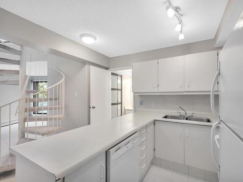 417 11618 100 Avenue, Edmonton, AB - Indoor Photo Showing Kitchen With Double Sink