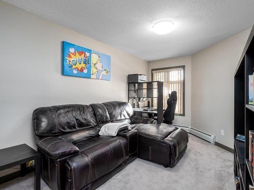 216 11615 Ellerslie Road, Edmonton, AB - Indoor Photo Showing Living Room