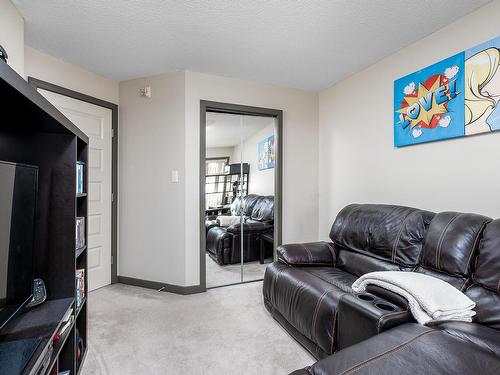 216 11615 Ellerslie Road, Edmonton, AB - Indoor Photo Showing Living Room