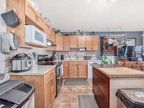 3407 47 Street, Beaumont, AB - Indoor Photo Showing Kitchen With Double Sink