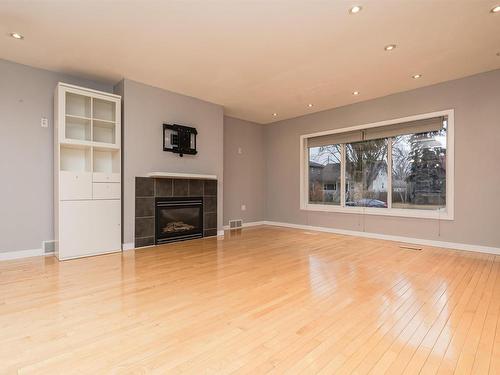 11231 75 Avenue, Edmonton, AB - Indoor Photo Showing Living Room With Fireplace